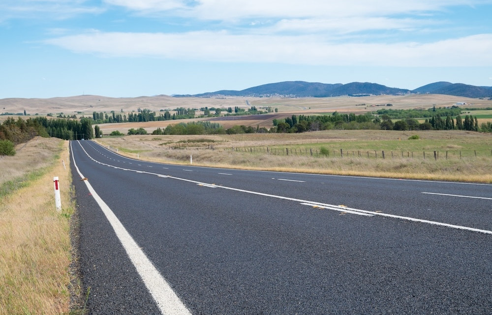 Artist impression of regional road upgrade works showing sealed road improvements in a rural Queensland landscape