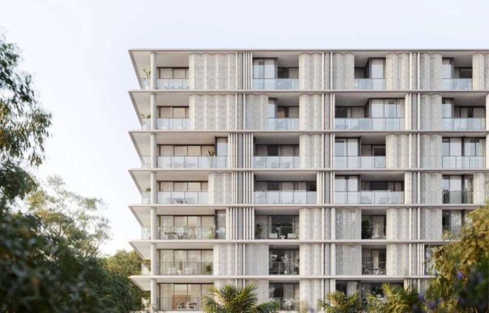 Artist impression of a modern riverfront residential development in Brisbane’s West End, showing landscaped terraces and apartment buildings under construction