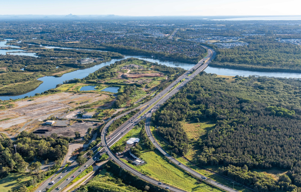 Artist’s impression of a major Queensland motorway and highway upgrade showing new lanes, overpasses, and transport infrastructure.